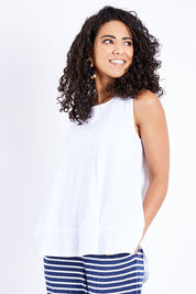 Model Pamela wearing size 10 of The Swing Tank in colour White (White), from the front, cropped image