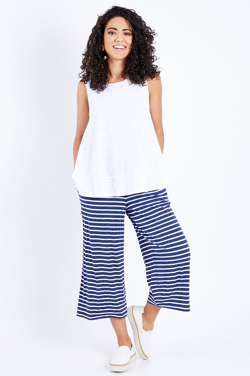 Model Pamela wearing size 10 of The Swing Tank in colour White (White), from the front, showing the whole outfit