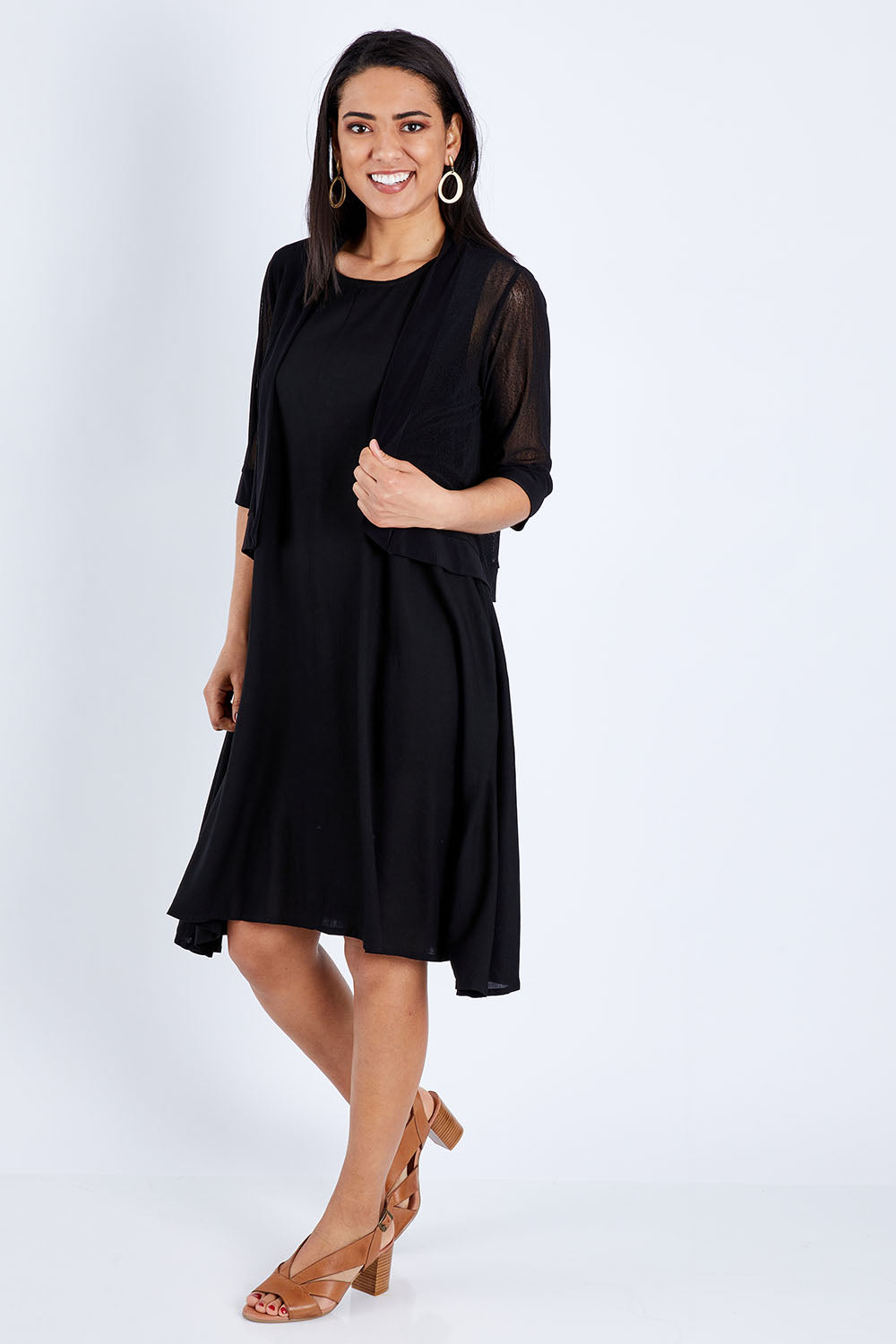 Model Pamela wearing size 10 of The Summer Shrug in colour Black (Black), from the front, showing the whole outfit