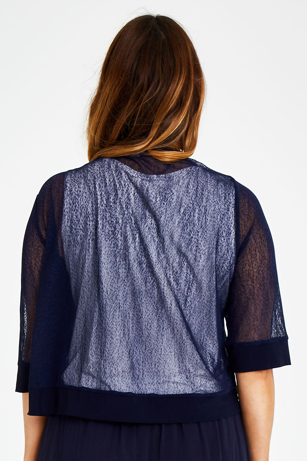 Model Laura wearing size 14 of The Summer Shrug in colour Navy (Blue), from the back