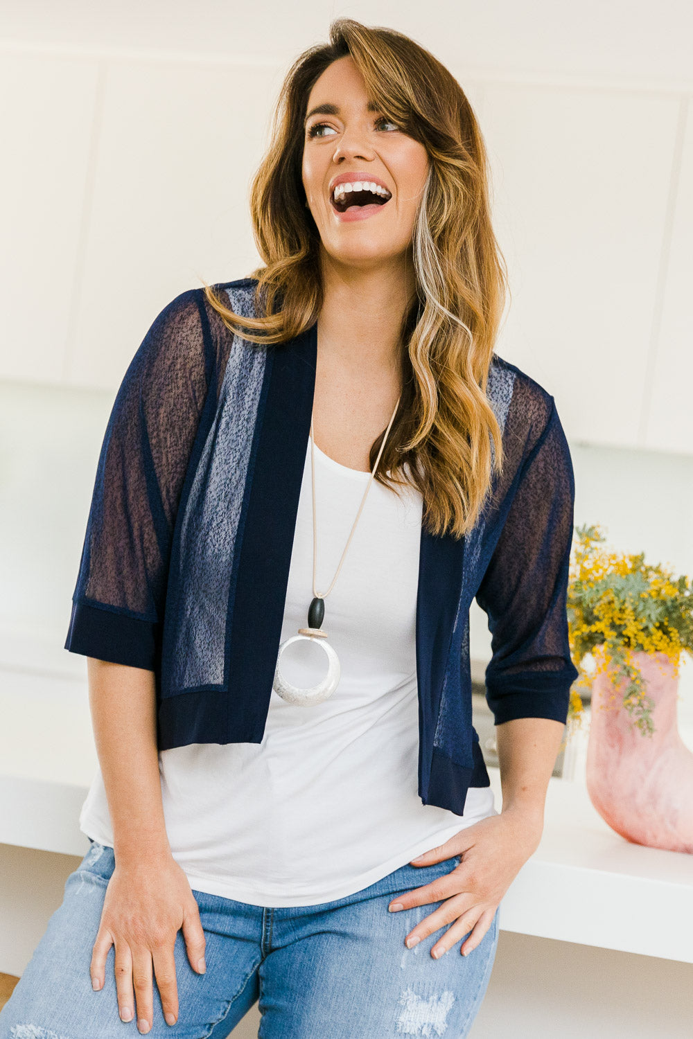 Model Laura wearing size 14 of The Summer Shrug in colour Navy (Blue), from the front, showing the whole outfit