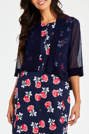Model Vitoria wearing size 10 of The Summer Shrug in colour Navy (Blue), from the front, cropped image