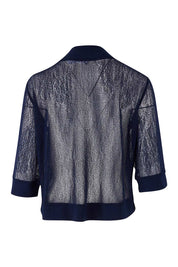 Product shot of The Summer Shrug in colour Navy (Blue), from the back