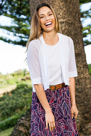 Model Amanda wearing size 10 of The Summer Shrug in colour White (White), from the front, showing the whole outfit