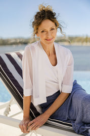 Model Emma wearing size 10 of The Summer Shrug in colour White (White), from the front, showing the whole outfit