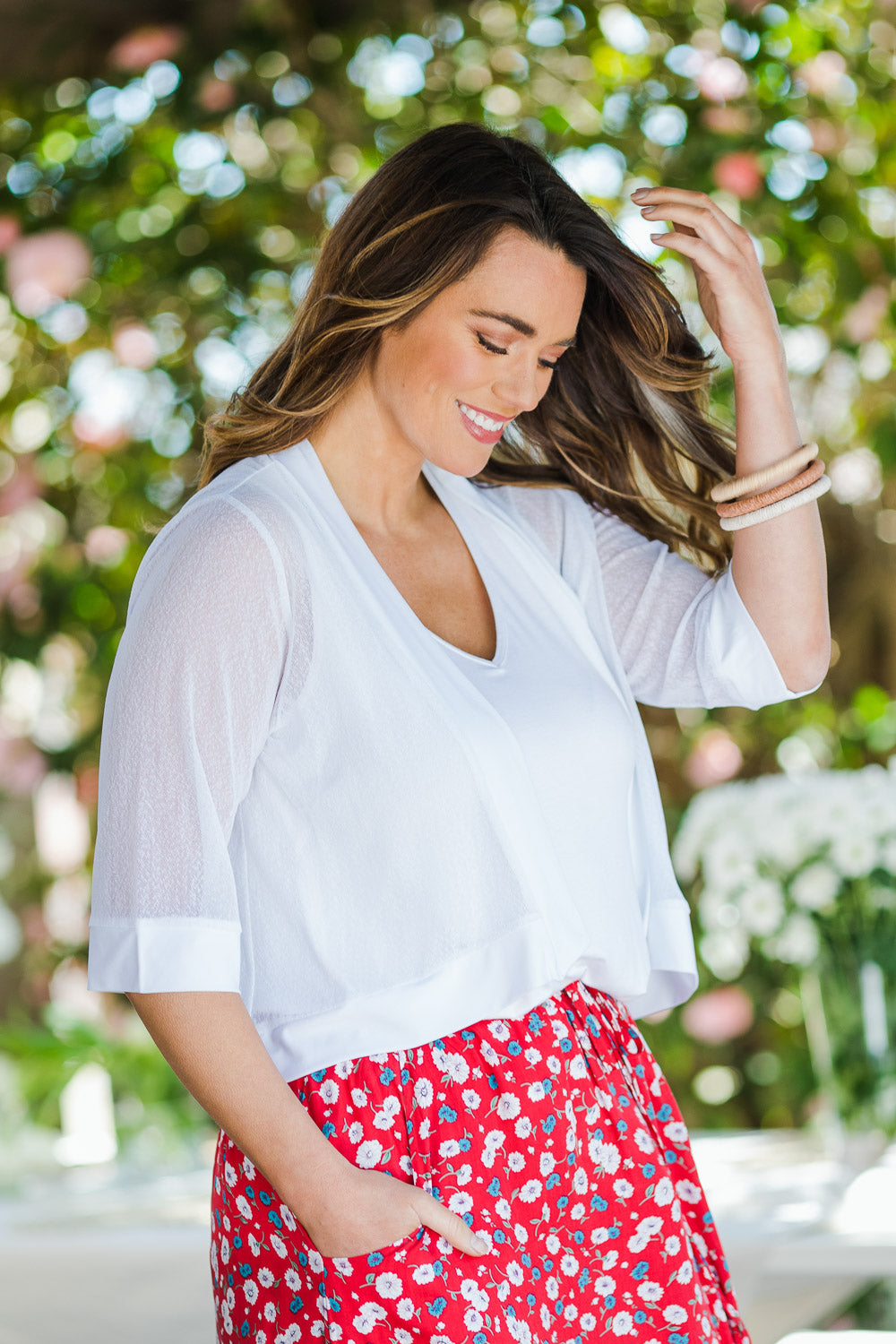 Model Laura wearing size 14 of The Summer Shrug in colour White (White), from the front, showing the whole outfit