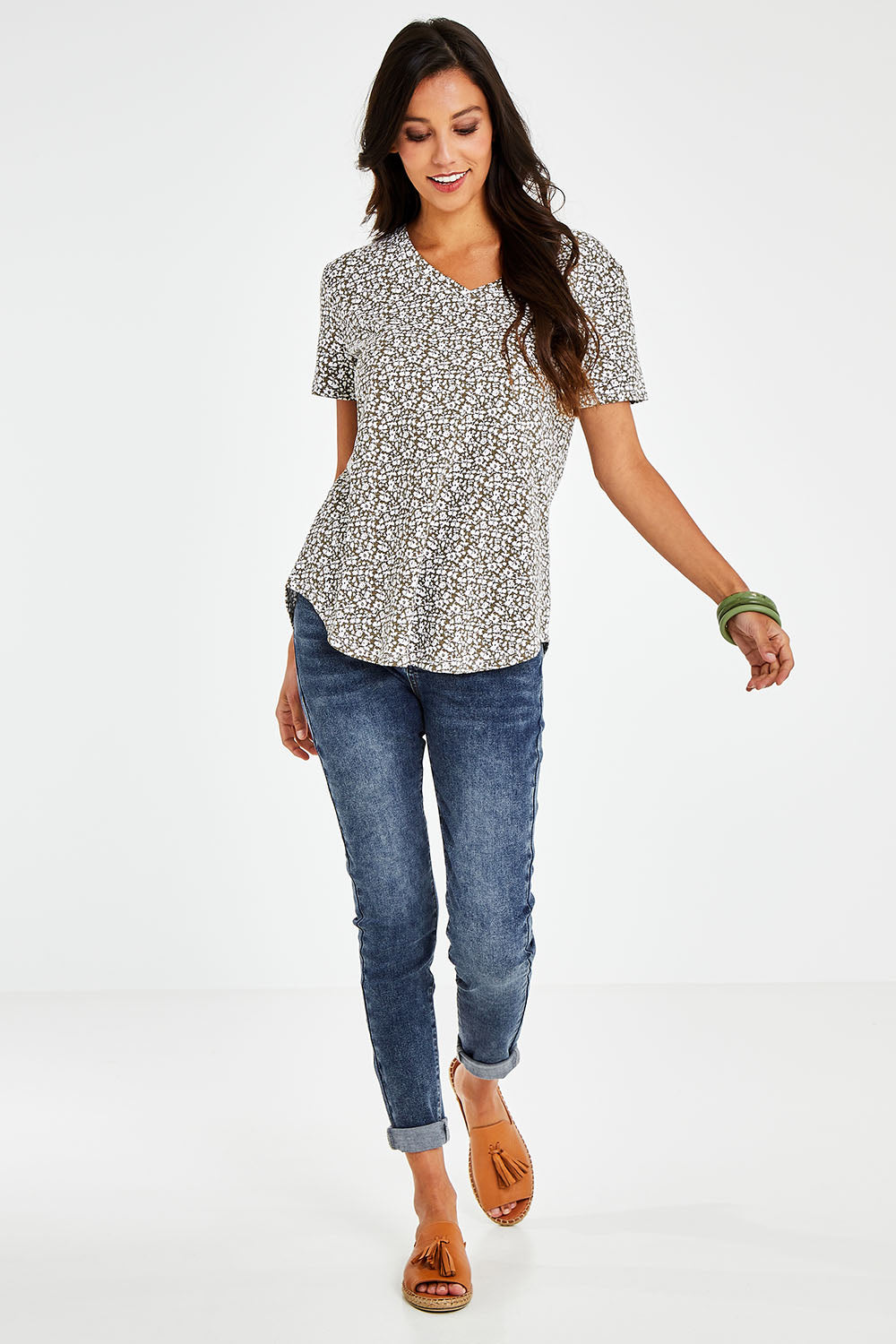 Model Vitoria wearing size 10 of The Feeling Spotty Tee in colour Khaki (Green), from the front, showing the whole outfit