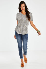 Model Vitoria wearing size 10 of The Feeling Spotty Tee in colour Khaki (Green), from the front, showing the whole outfit