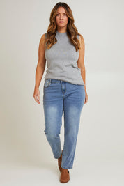 Model Laura wearing size 14 of The Boyfriend Slim Leg Jean in colour Blue (Blue), from the front, showing the whole outfit