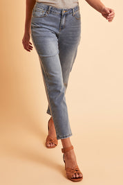 Model Madeline wearing size 10 of The Boyfriend Slim Leg Jean in colour Blue (Blue), from the front, showing the whole outfit