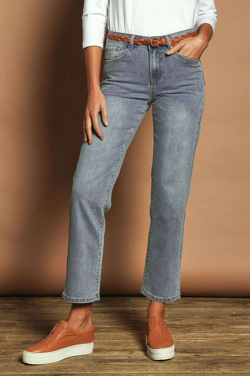 Model Madeline wearing size 10 of The Boyfriend Jean in colour Blue (Blue), from the front, cropped image