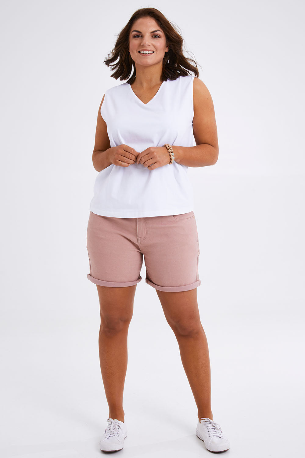 Model Monique wearing size 14 of The 5 Pocket Denim Short in colour Rosepink (Pink), from the front, showing the whole outfit