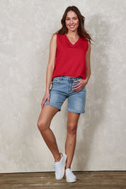 Model Madeline wearing size 10 of The 5 Pocket Denim Short in colour Lightdenim (Blue), from the front, showing the whole outfit