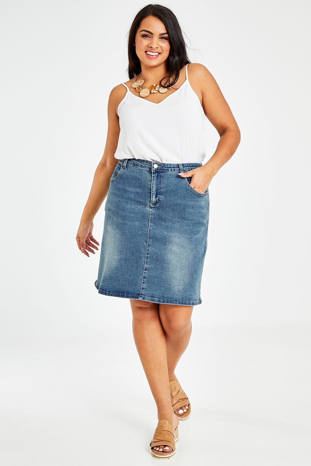 Model Sasha-Lee wearing size 16 of The 5 Pocket Denim Skirt in colour Denim (Blue), from the front, showing the whole outfit