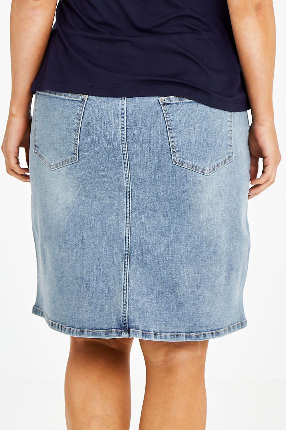 Model Laura wearing size 14 of The 5 Pocket Denim Skirt in colour Lightdenim (Blue), from the back
