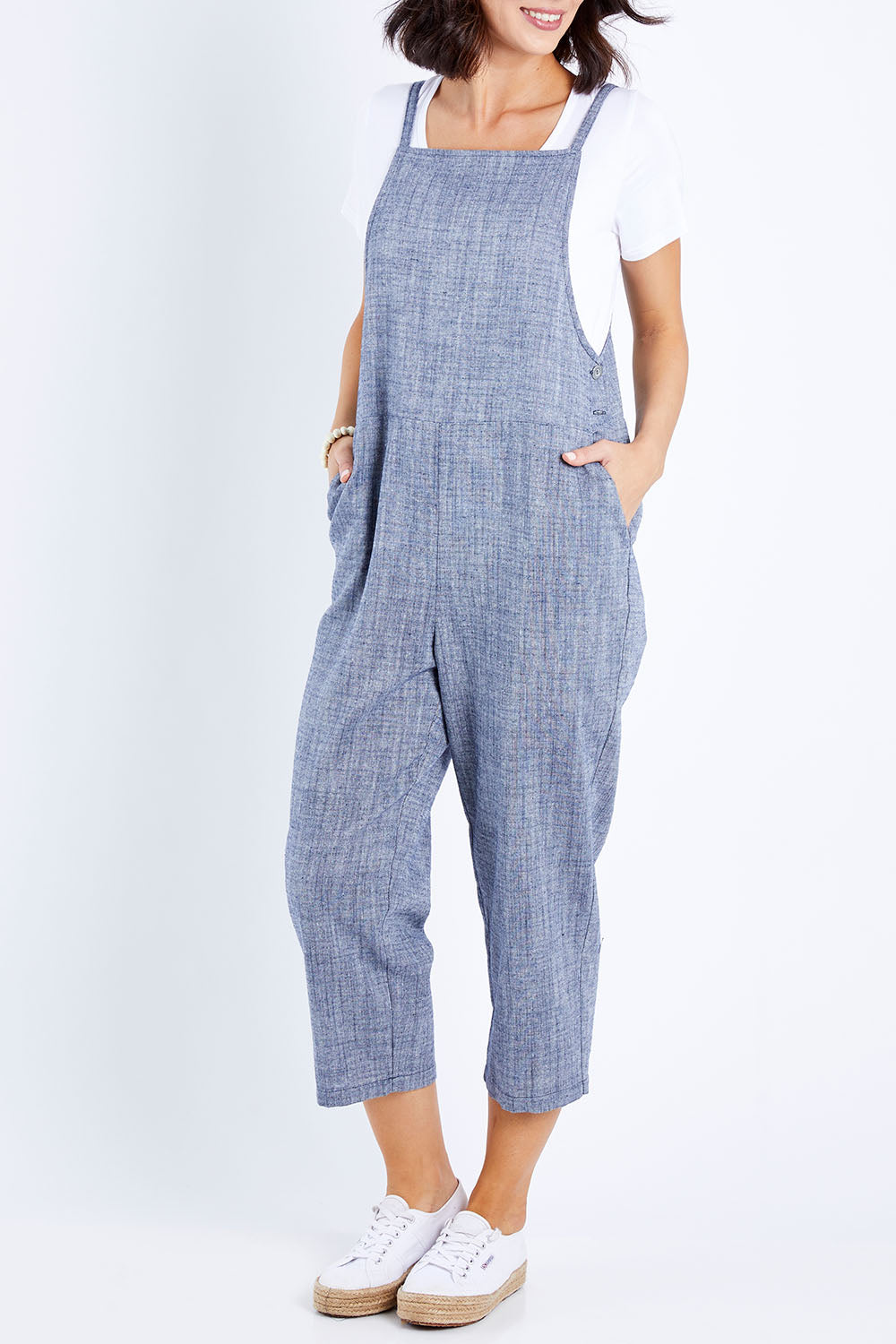 Model Andrea wearing size 10 of The Comfort Overall in colour Bluemarle (Blue), from the front, cropped image