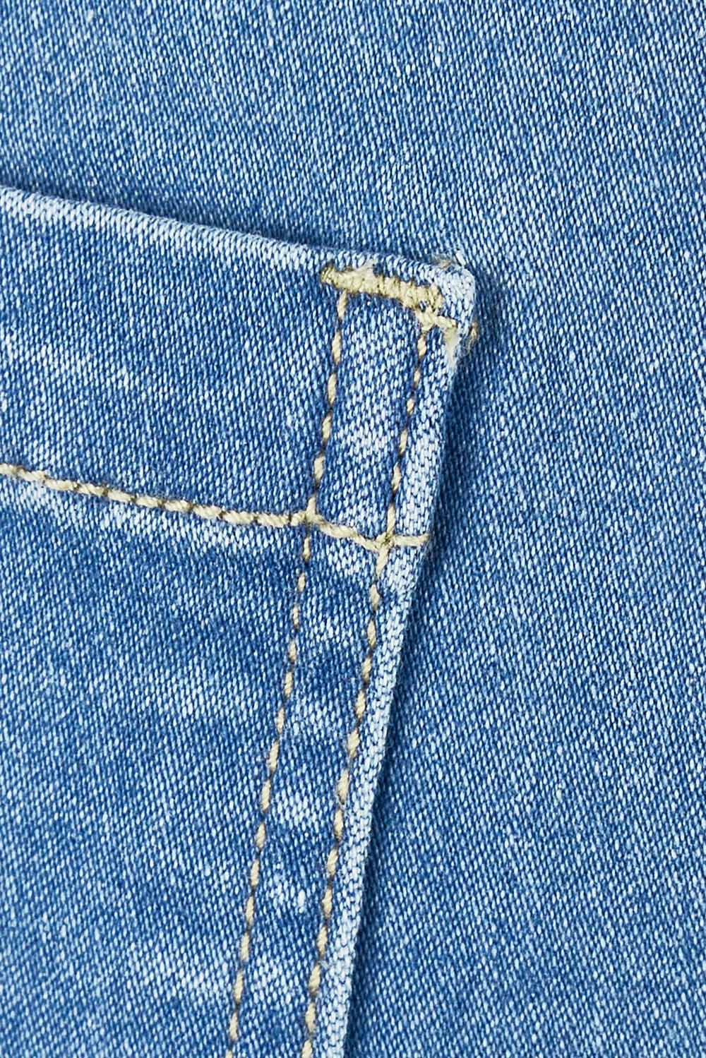 Product shot of The Pull On Denim Skirt in colour Middenim (Blue), detail