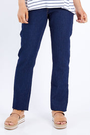 Model Pamela wearing size 10 of The Essential 5 Pocket Slim Jean in colour Darkdenim (Blue), from the front, cropped image