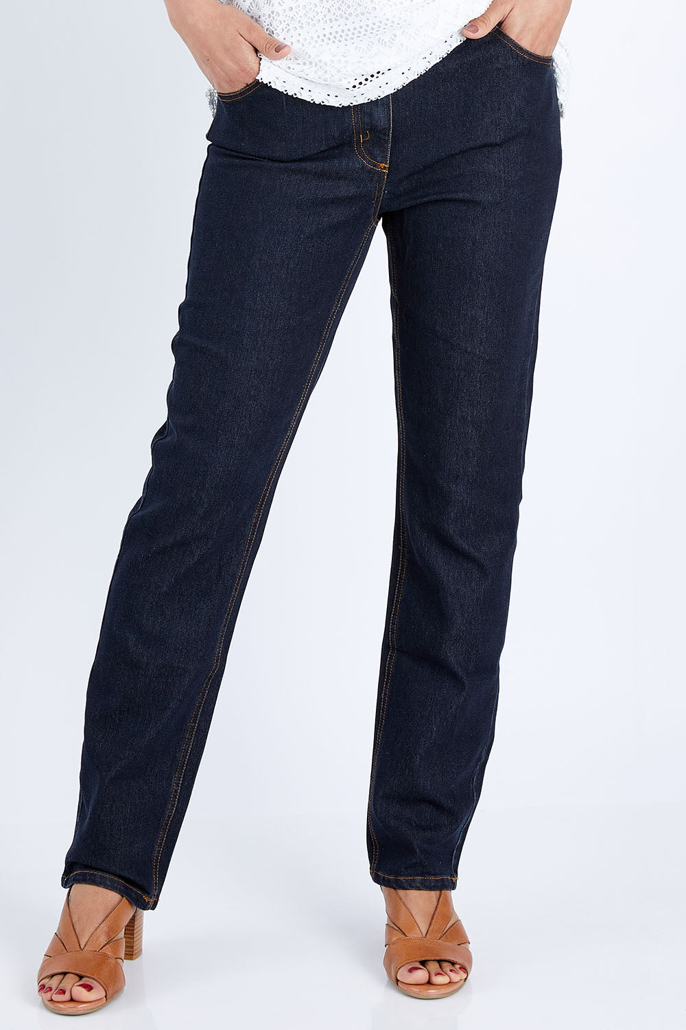 Model Pamela wearing size 10 of The Essential 5 Pocket Slim Jean in colour Darkdenim (Blue), from the front, cropped image