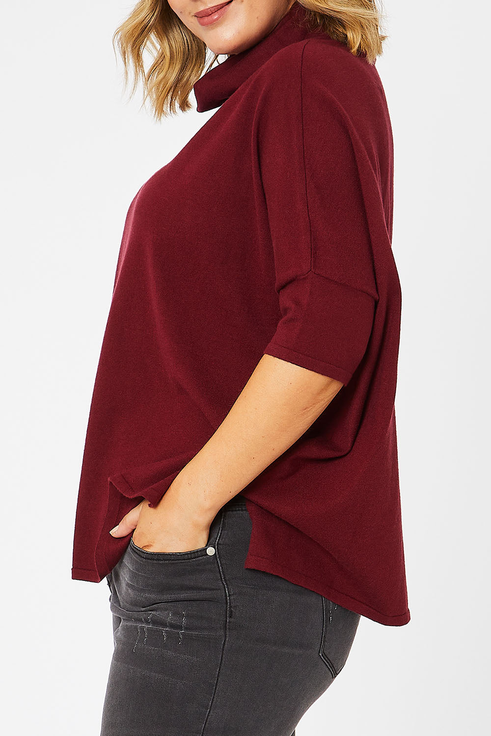 Model Jess wearing size L of The Roll Neck Easy Wear Jumper in colour Shiraz (Red), from the front, cropped image