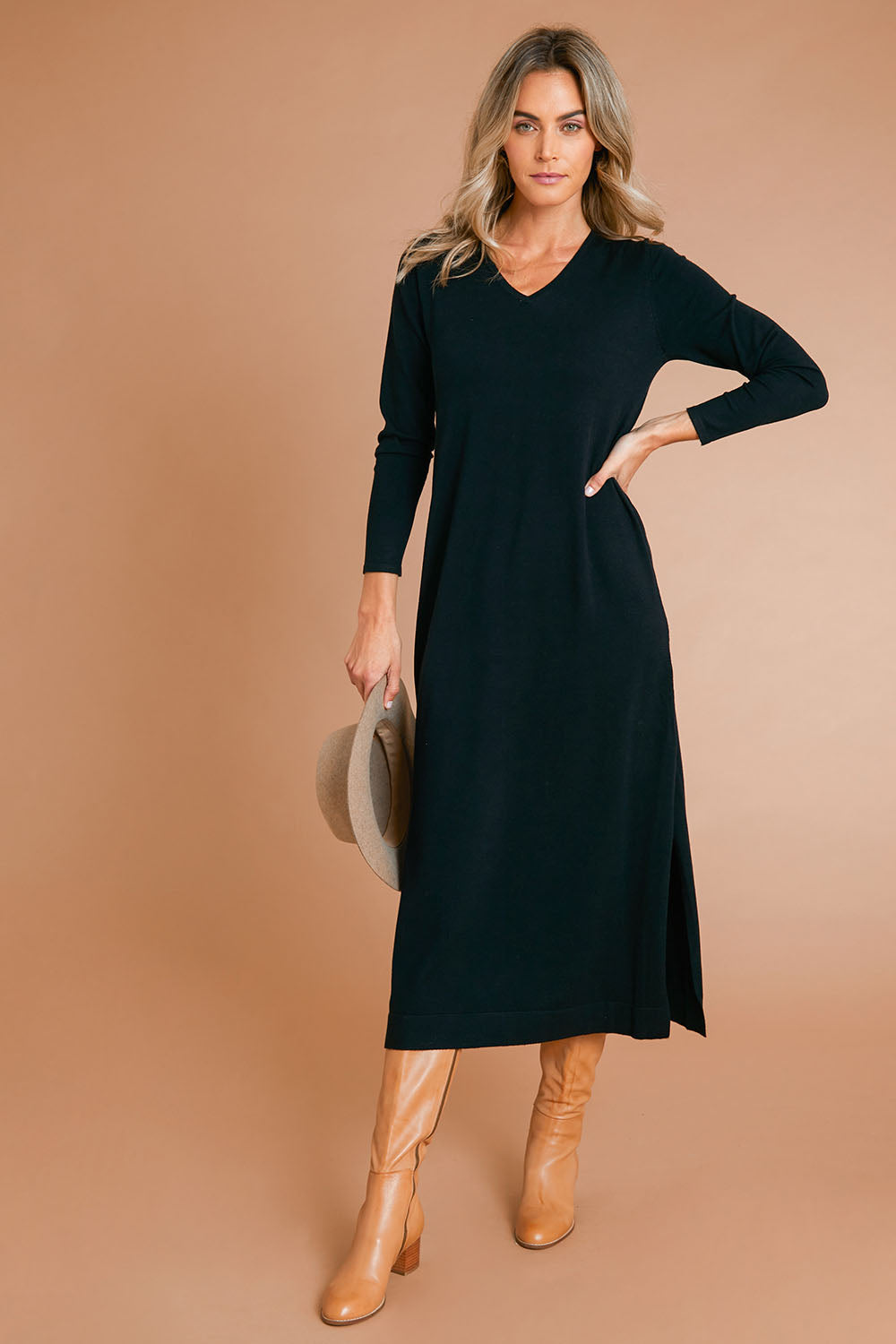 Model Alice wearing size S of The Comfort True Knit Dress in colour Black (Black), from the front, showing the whole outfit