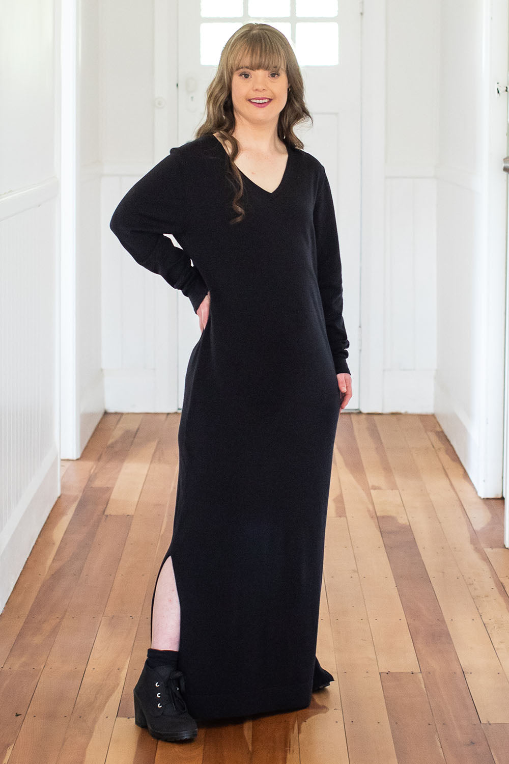 Model Katie wearing size S of The Comfort True Knit Dress in colour Black (Black), from the front, showing the whole outfit