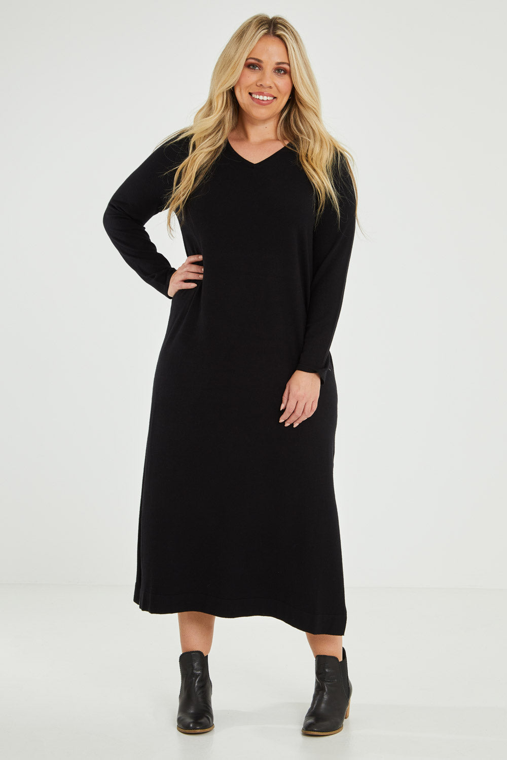 Model Katie wearing size XL of The Comfort True Knit Dress in colour Black (Black), from the front, showing the whole outfit