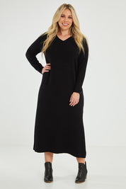 Model Katie wearing size XL of The Comfort True Knit Dress in colour Black (Black), from the front, showing the whole outfit