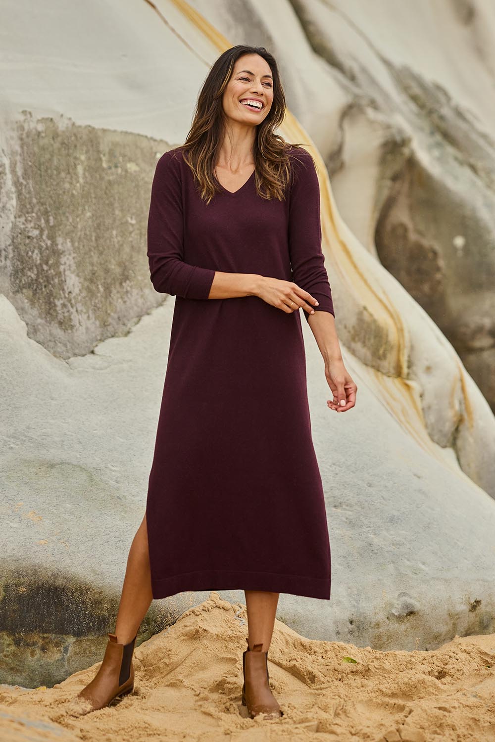 Model Amanda wearing size S of The Comfort True Knit Dress in colour Burntplum (Purple), from the front, showing the whole outfit