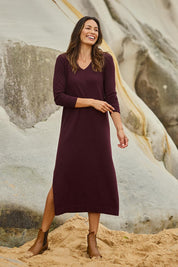Model Amanda wearing size S of The Comfort True Knit Dress in colour Burntplum (Purple), from the front, showing the whole outfit