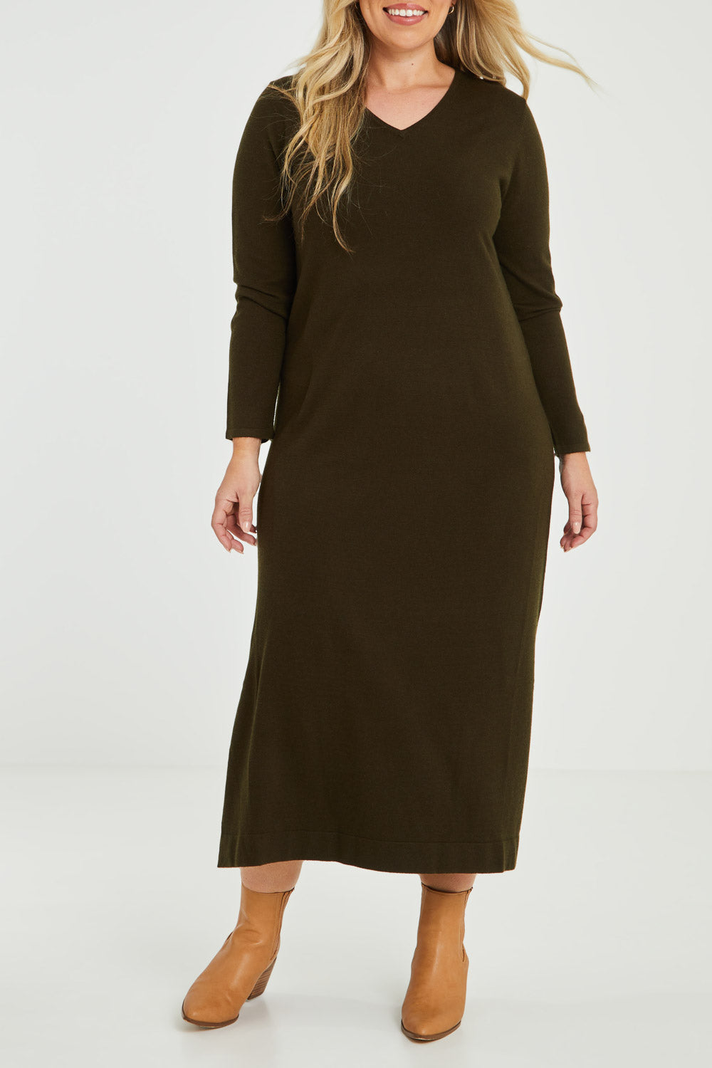 Model Katie wearing size XL of The Comfort True Knit Dress in colour Darkolive (Green), from the front, cropped image