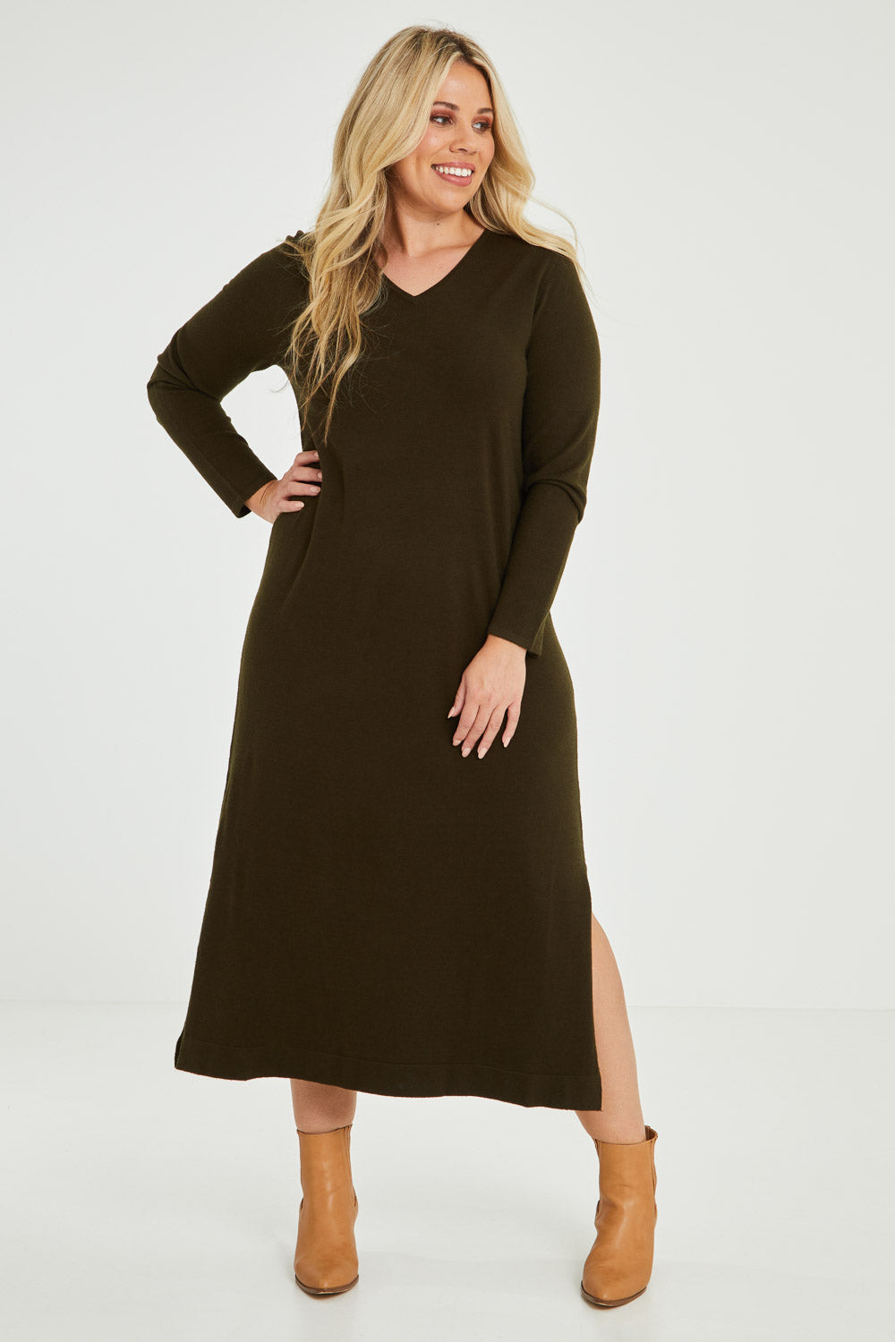 Model Katie wearing size XL of The Comfort True Knit Dress in colour Darkolive (Green), from the front, showing the whole outfit