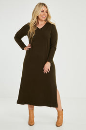 Model Katie wearing size XL of The Comfort True Knit Dress in colour Darkolive (Green), from the front, showing the whole outfit