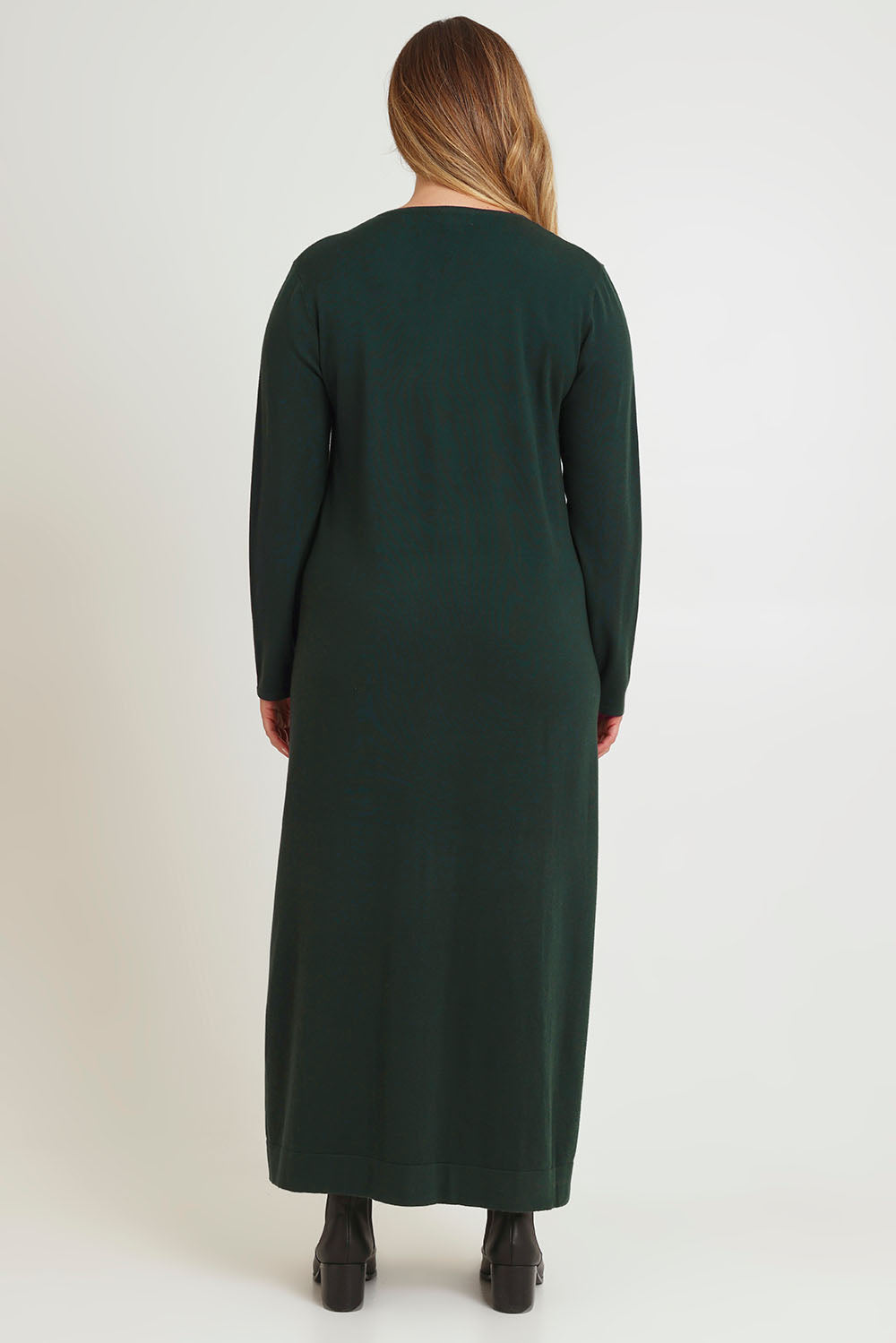 Model Chanel wearing size XL of The Comfort True Knit Dress in colour Darkpine (Green), from the back