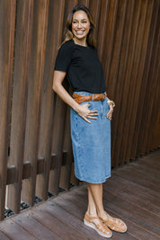 Model Amanda wearing size 10 of The Midi Denim Skirt in colour Denim (Blue), from the front, showing the whole outfit