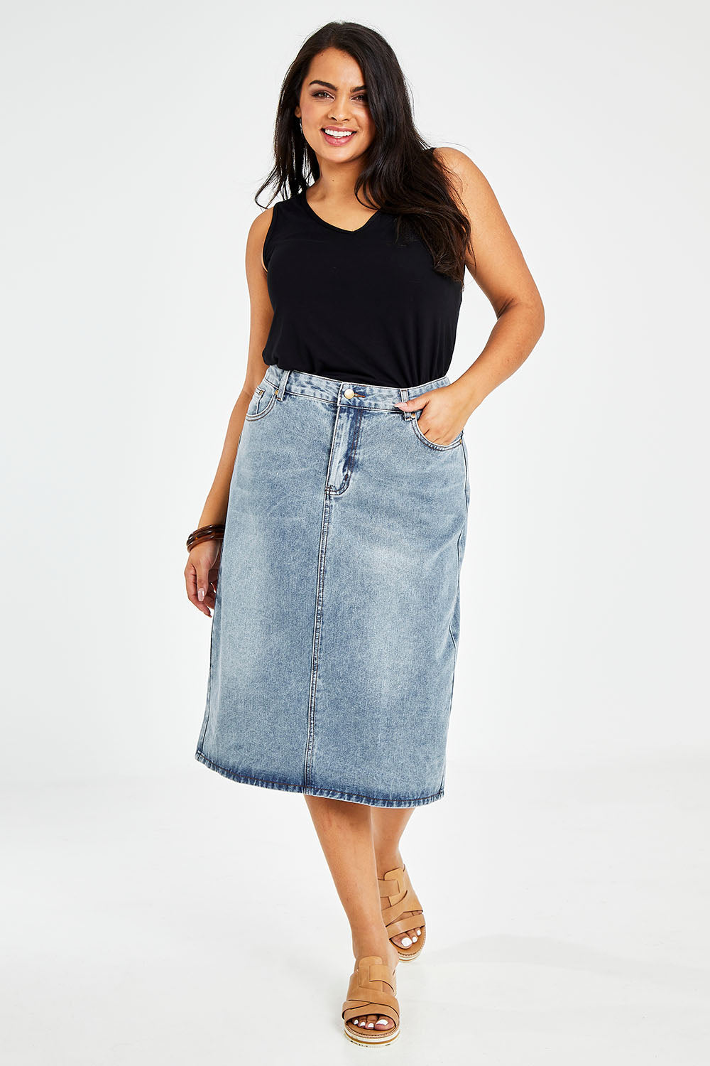 Model Sasha-Lee wearing size 16 of The Midi Denim Skirt in colour Denim (Blue), from the front, showing the whole outfit