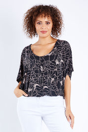 Model Lala wearing size 10 of The Relaxed Button Print Tee in colour Pinkfloral (Black), from the front, cropped image