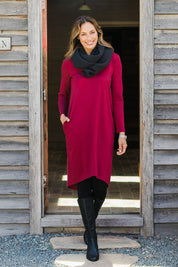 Model Amanda wearing size 10 of The V Neck Essential Ponte Dress in colour Pomegranat (Red), from the front, showing the whole outfit