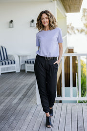 Model Emma wearing size 10 of The Full Length Best Seller Pant in colour Black (Black), from the front, showing the whole outfit