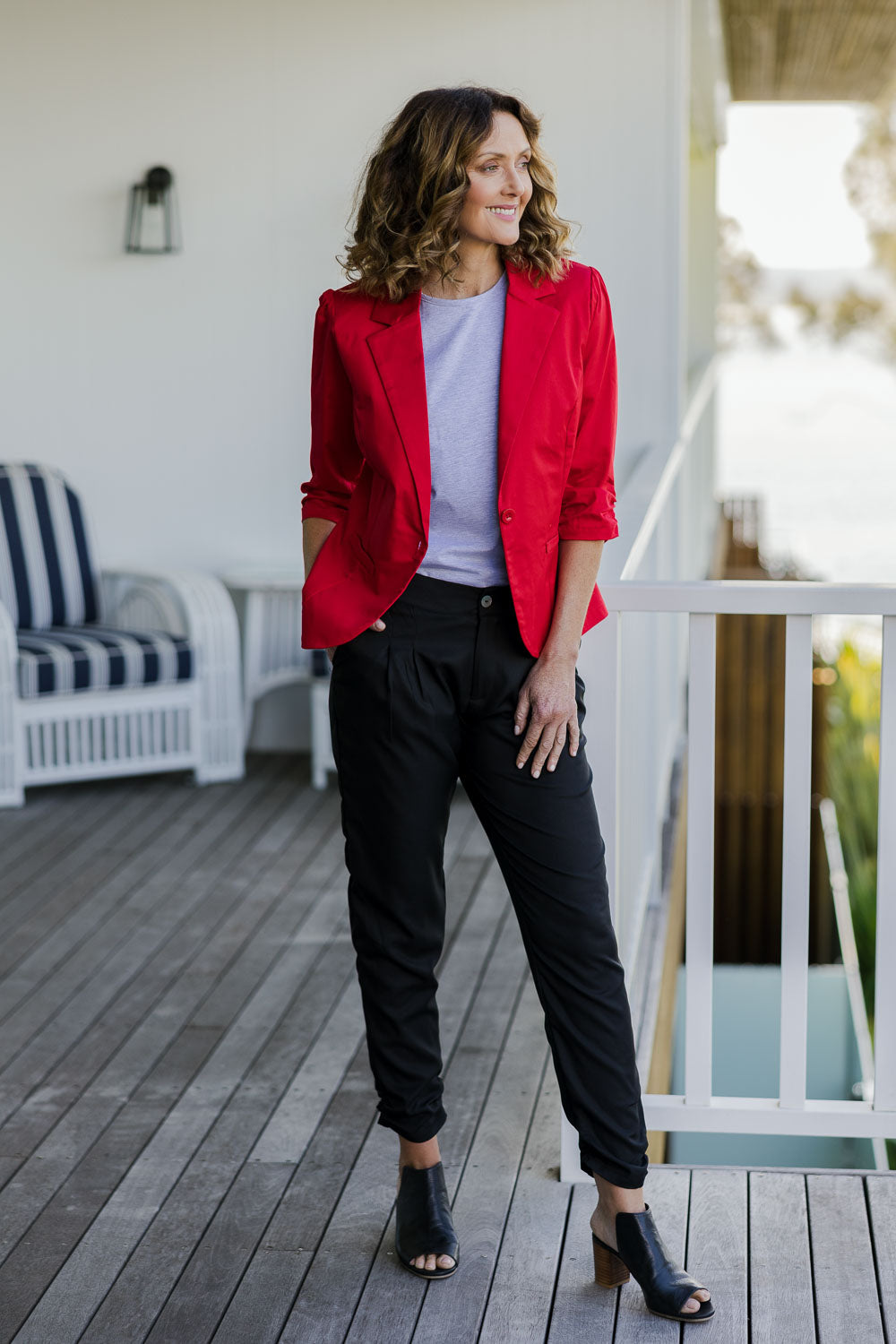 Model Emma wearing size 10 of The Full Length Best Seller Pant in colour Black (Black), from the front, showing the whole outfit
