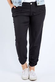Model Jess wearing size 14 of The Full Length Best Seller Pant in colour Black (Black), from the front, cropped image