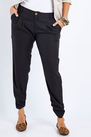 Model Lala wearing size 10 of The Full Length Best Seller Pant in colour Black (Black), from the front, cropped image