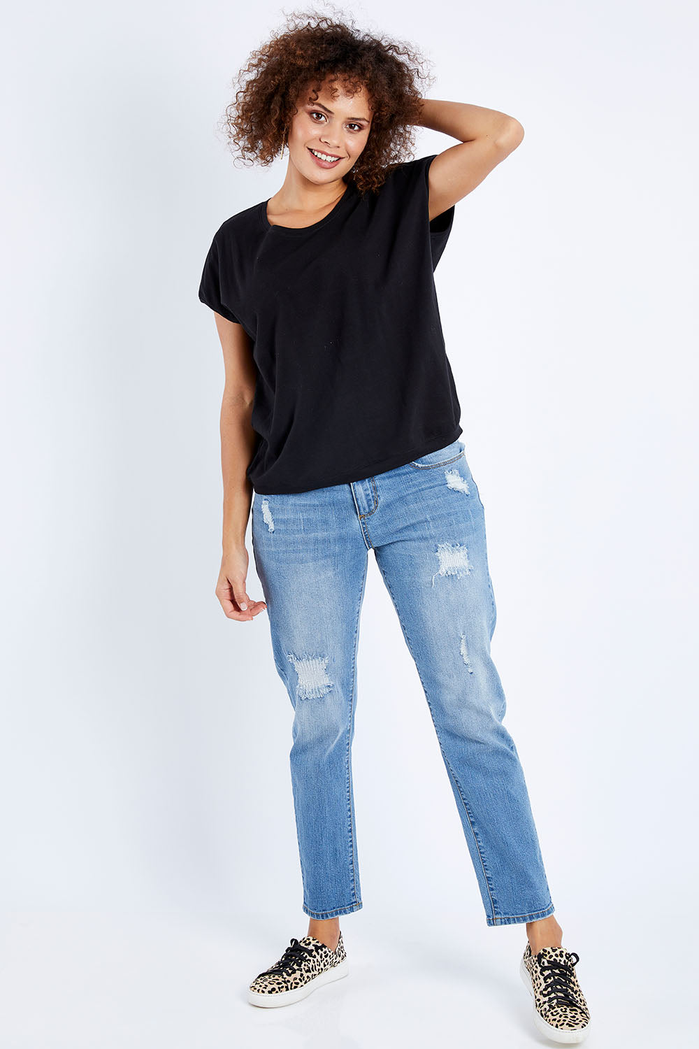 Model Lala wearing size 10 of The Shell Tee in colour Black (Black), from the front, showing the whole outfit