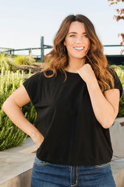 Model Laura wearing size 14 of The Shell Tee in colour Black (Black), from the front, showing the whole outfit