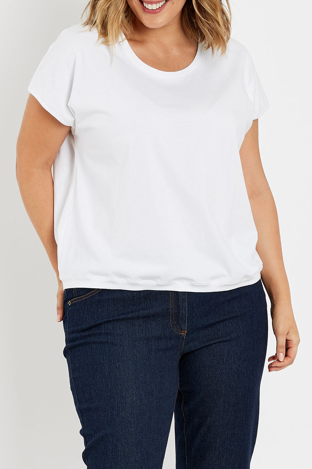 Model Jess wearing size 14 of The Shell Tee in colour White (White), from the front, cropped image