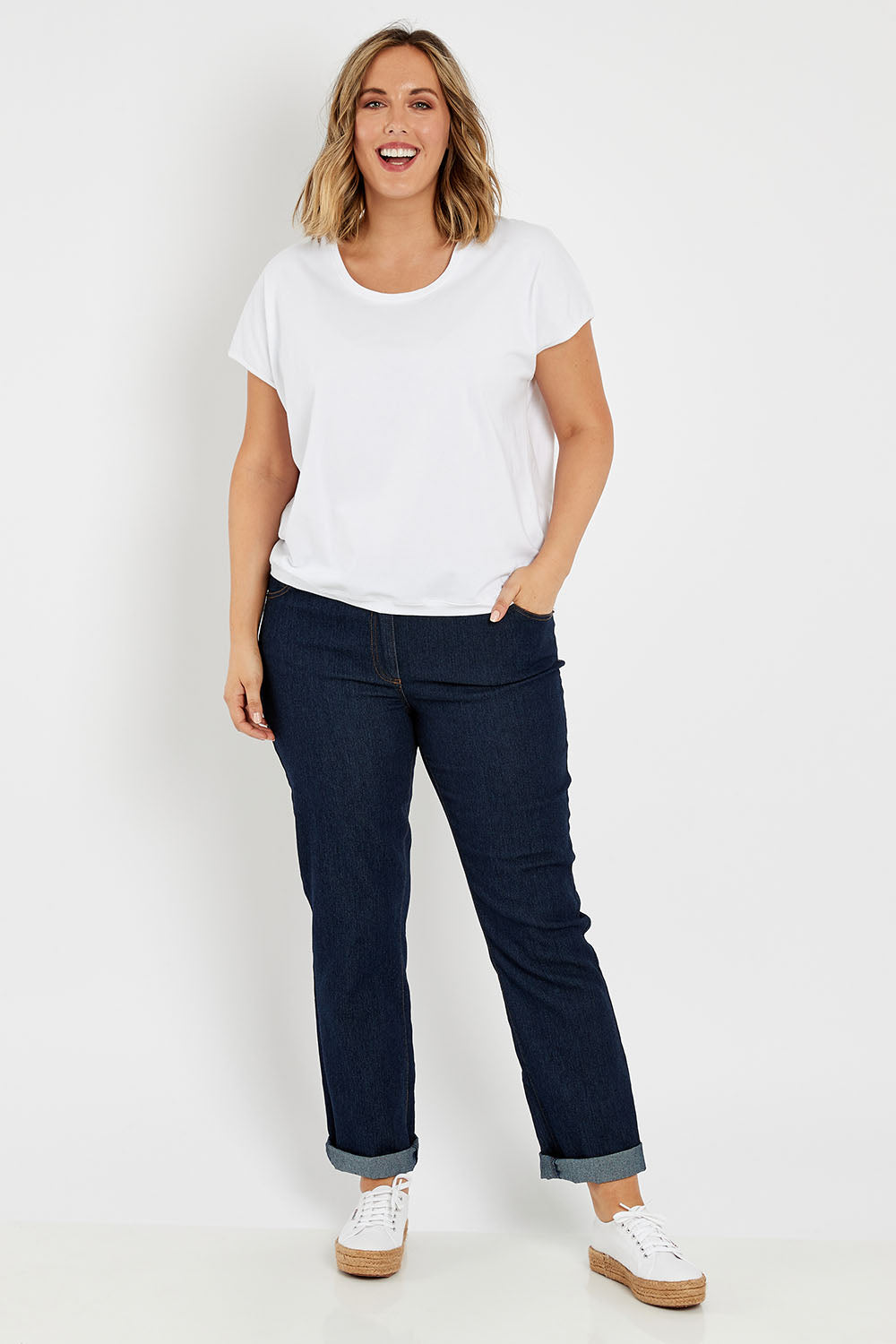 Model Jess wearing size 14 of The Shell Tee in colour White (White), from the front, showing the whole outfit