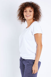 Model Lala wearing size 10 of The Shell Tee in colour White (White), from the front, cropped image