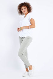 Model Lala wearing size 10 of The Slouch Tee in colour White (White), from the front, showing the whole outfit