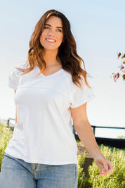 Model Laura wearing size 14 of The Slouch Tee in colour White (White), from the front, showing the whole outfit