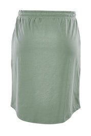Product shot of The Drawcord Skirt in colour Khaki (Green), from the back